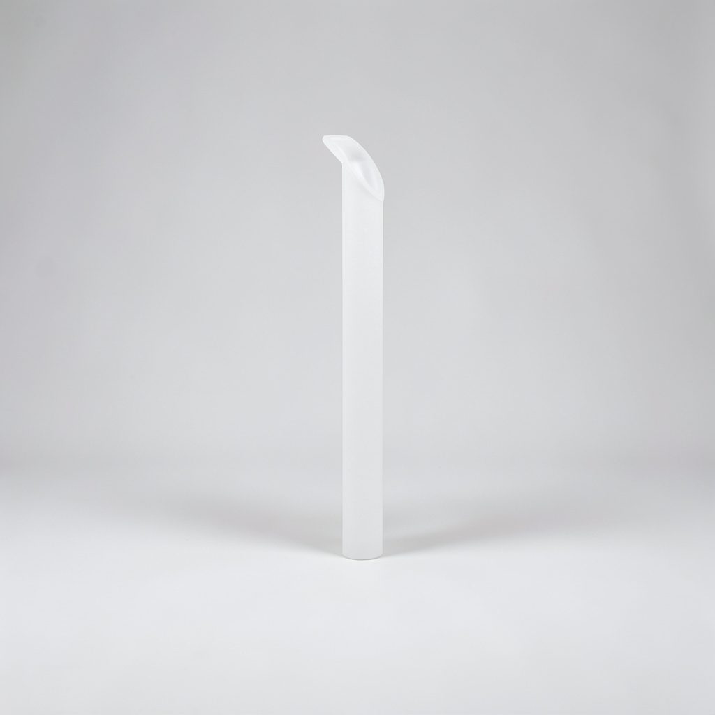 A warm, intimate studio photograph of an acoustic guitar resting against a dark velvet backdrop, with soft amber light catching the strings and wood grain.